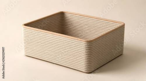Empty Square Woven Storage Basket with Coiled Rope Texture for Minimalist Home Organization and Interior Decorating on Neutral Beige Background for Clean Lifestyle Photography