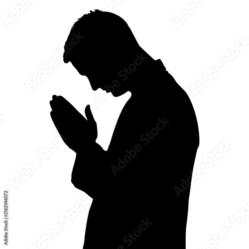 Foto Black silhouette of a man praying WITH HIS HANDS IN THE FIST