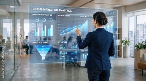 Businesswoman analyzing digital marketing analytics dashboard with growth trends and conversion funnel charts on transparent screen in modern corporate office environment