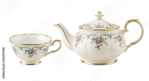 Canvas Print Vintage porcelain teacup and teapot with floral pattern and gold trim