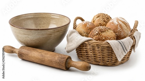 Rustic ceramic kitchenware and bread in wicker basket