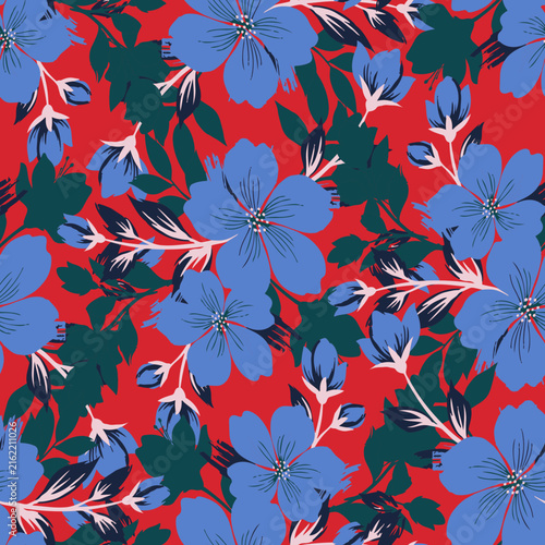 Bold floral repeat print with blue flowers and green foliage on a red backdrop. Perfect for modern fashion, summer textiles, and wallpaper.