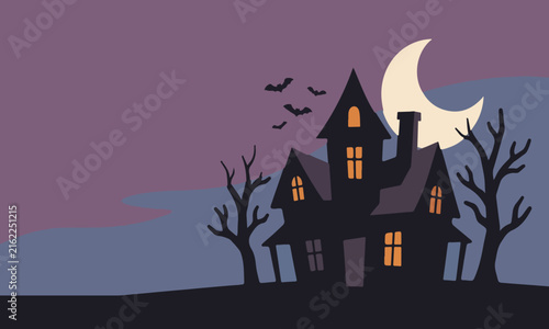 фотографія Spooky Halloween haunted house silhouette with crescent moon and flying bats