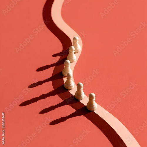 A Line of White Chess Pawns on a Winding Path