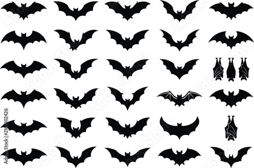 Set of black flying and hanging bat silhouettes isolated on white background for Halloween graphic design