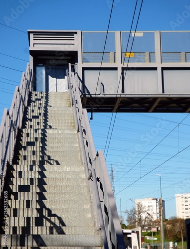 Metal pedestrian bridge stairs leading to skywalk. in Cete, Portugal - Norte