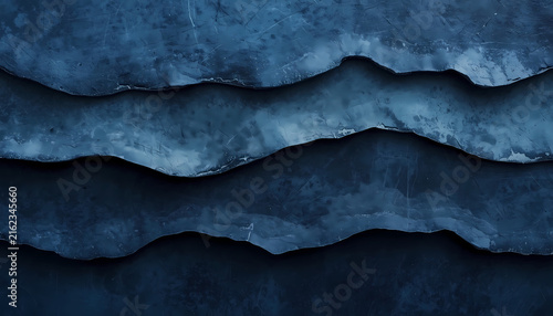 A close-up view of a dark blue, layered, wavy textured surface with a rough, uneven finish