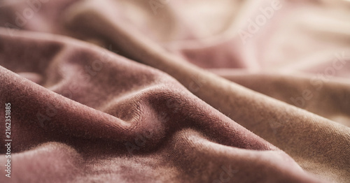 Obraz na plátně Dusty rose velvet unfolds beneath warm gentle light, revealing plush fibers, gra