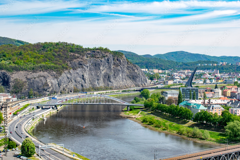 Fototapeta premium Usti nad Labem cityscape with the river and a rock formation