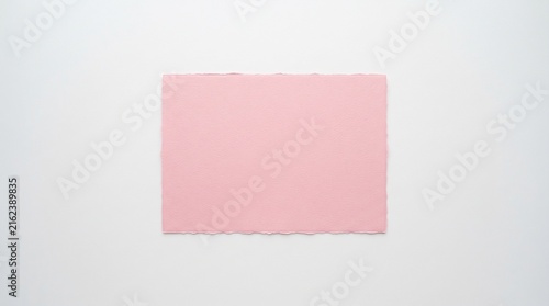 Blank pink paper card with scalloped edges on white background