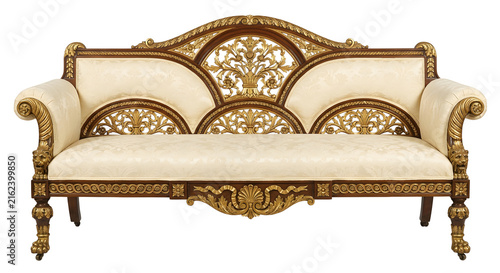 Obraz na plátně Ornate wooden sofa with gold leaf carvings and cream upholstery
