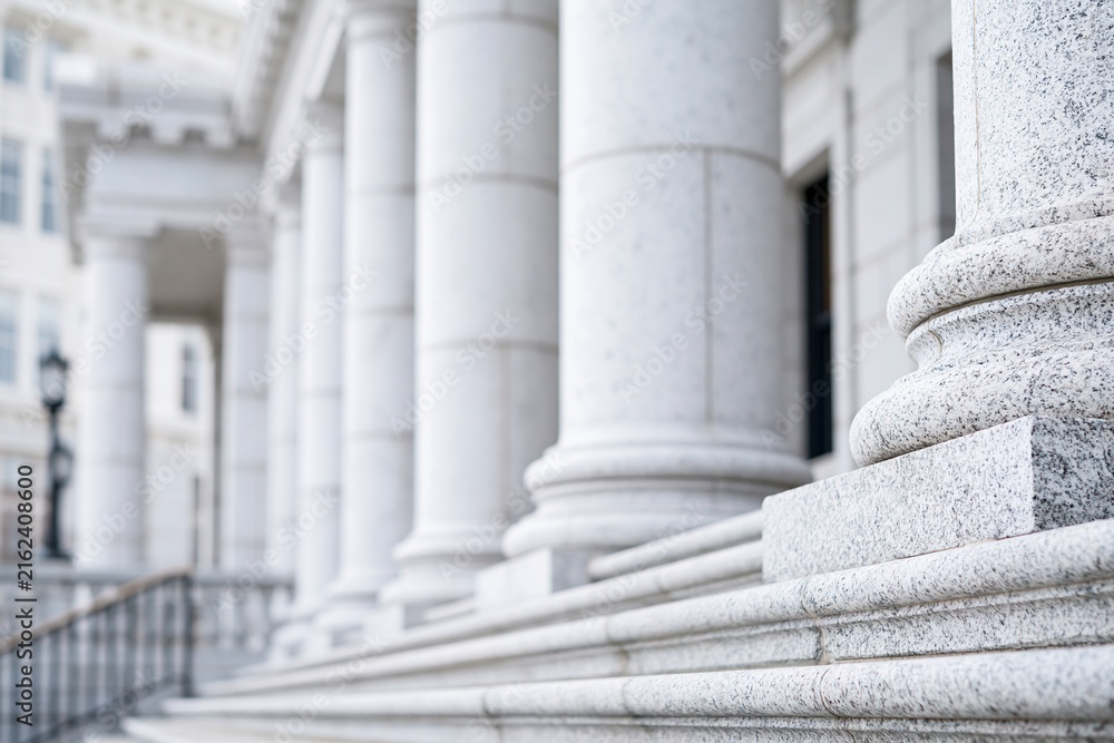 Fototapeta premium Grand White Marble Columns and Stairs of a Neoclassical Building, Symbolizing Justice and Authority