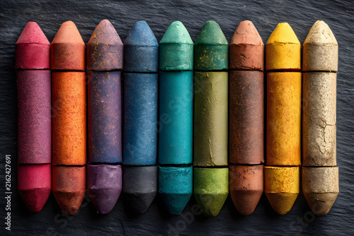 Vibrant Multicolored Crayons Arranged on Slate Background for Art and Craft Design