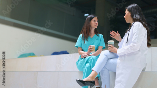 Doctors and nurses discussing healthcare during a coffee break