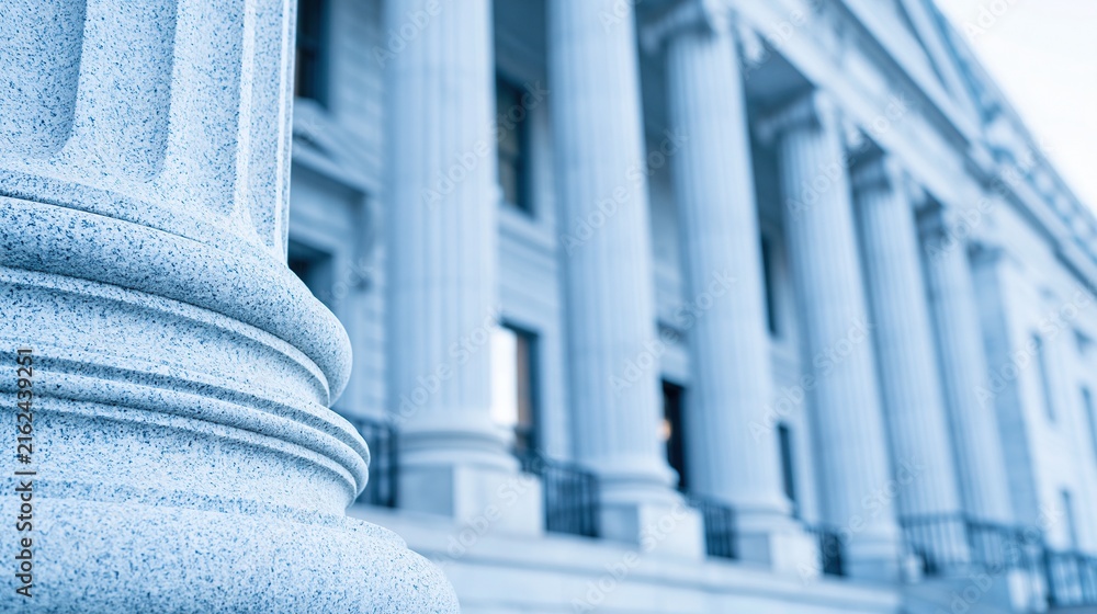 Naklejka premium Classic stone column and grand facade of a government building, representing justice and law