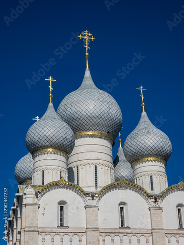 Canvastavla Orthodox Church with Golden Crosses Against a Deep Blue Sky