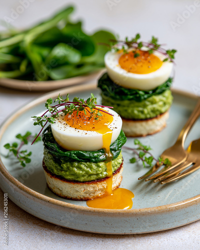 Elegant egg bite with spinach and avocado mousse showcasing GLP1 friendly mini meal nutrition high protein wellness and luxury food styling