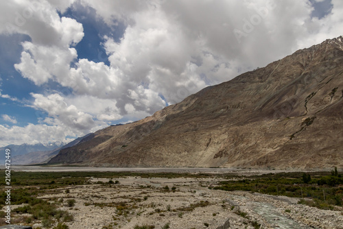 Fototapeta kuchenna Dramatic mountain valley under storm clouds
