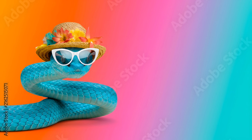 Stylish summer viper: blue insularis pit viper snake wearing a floral straw hat and white cat-eye sunglasses against a vibrant gradient orange pink and teal background with copy space