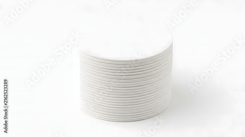 Stack of circular white coffee filter papers against a clean white background.