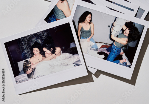 Mockup of polaroid frames lie on a flat surface. The frames are all empty and ready for images.