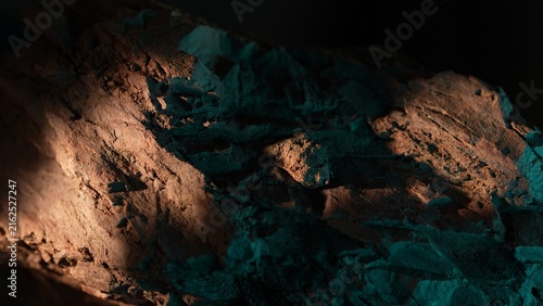 Rock surface with warm light and teal shadow abstract background texture
