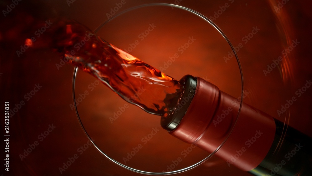 Naklejka premium Wine Pouring Into Glass From Below