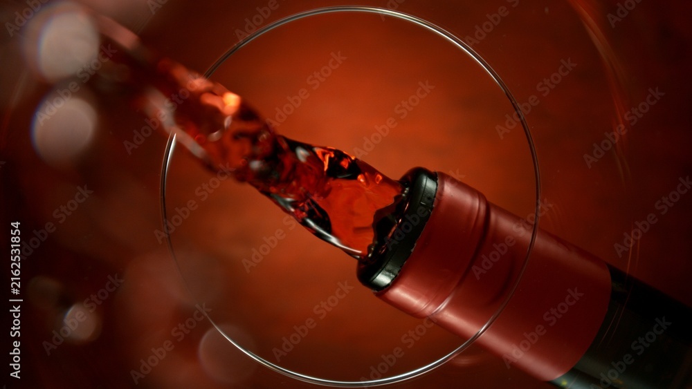 Naklejka premium Wine Pouring Into Glass From Below