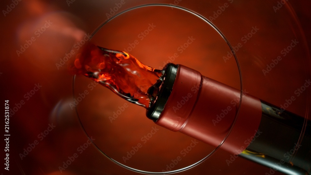 Naklejka premium Wine Pouring Into Glass From Below