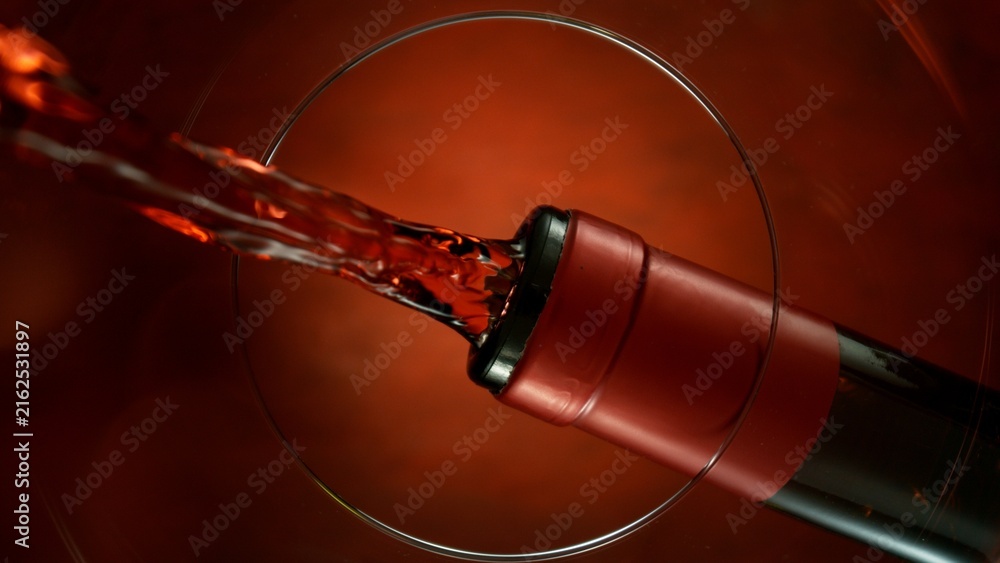 Naklejka premium Wine Pouring Into Glass From Below