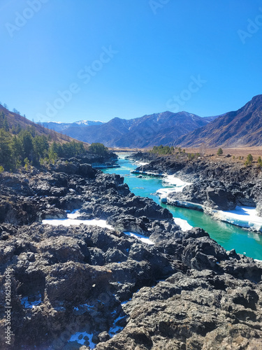 Canvastavla Altai, Russia, Turquoise mountain river flowing through rugged rocky gorge with