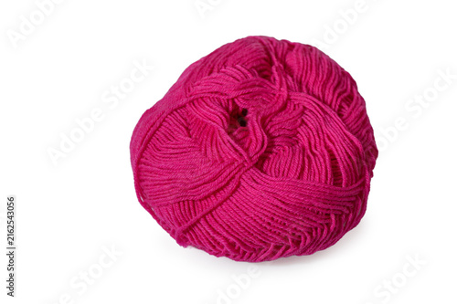 Obraz na płótnie Vibrant pink ball of yarn resting on a clean, white surface for creative craftin