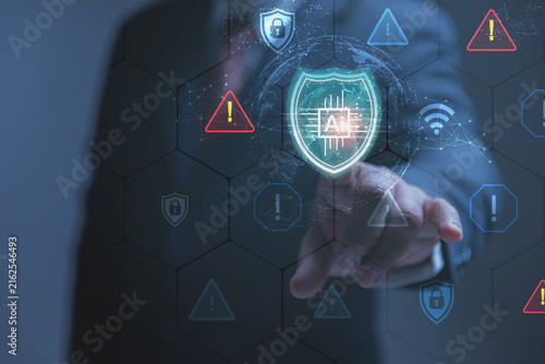 A businessman taps a glowing shield icon to activate an artificial intelligence cybersecurity system. High-tech security shields and warning triangles appear on a screen to show threat management.