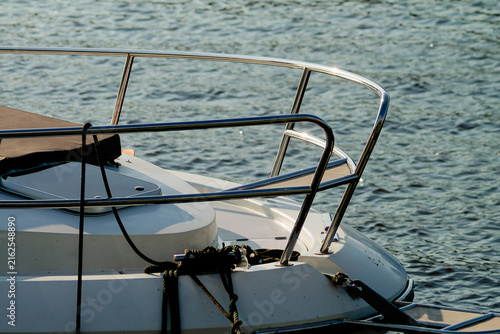 Obraz na plátne Horizontal nautical detail photo of boat bow on rippling water real life photogr