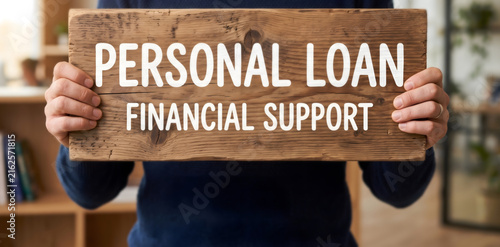 Personal Loan, Financial Support, Hands holding wooden sign with words Personal Loan