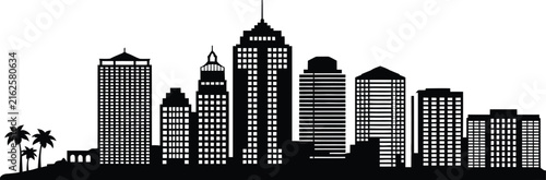 Modern city skyline silhouette at dusk with palm trees and skyscrapers building