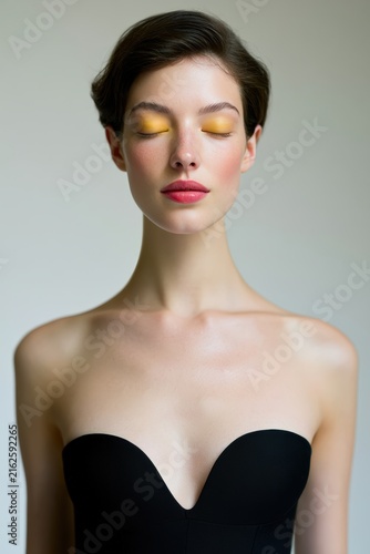 Elegant Model in Strapless Cocktail Dress Showcasing Fashion Trends