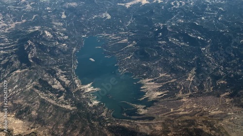 flying along Lake Davis, an artificial lake in Plumas County, California, USA, near the Sierra Nevada community of Portola, located in the Plumas National Forest, 4k aerial video footage 