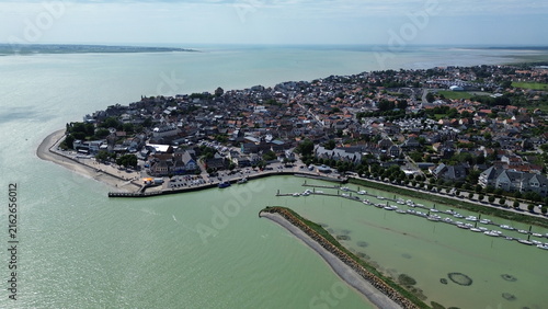 Obraz na płótnie Aerial view of Le Crotoy waterfront promenade and harbor with shallow bay waters