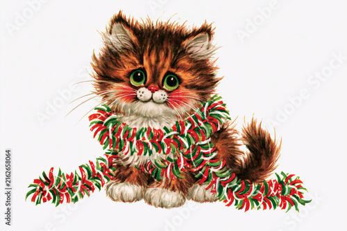 Adorable kitten wrapped in festive garland with big green eyes  