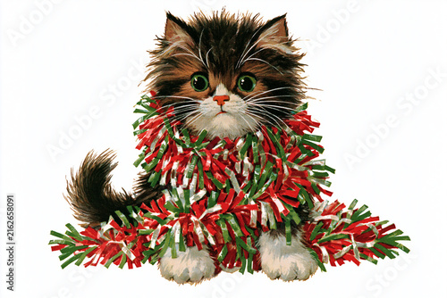 Cute kitten wrapped in festive garland with green and red colors  