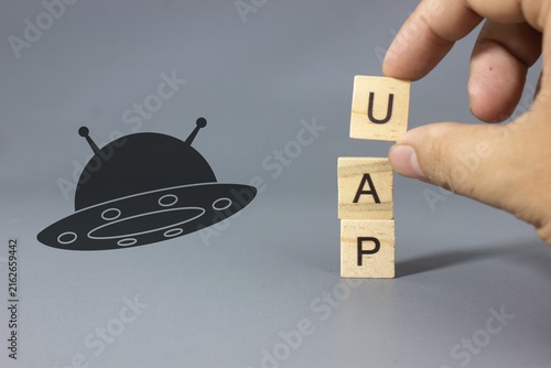 Konstfotografi UFO silhouette with the word UAP, representing unidentified aerial phenomena, al