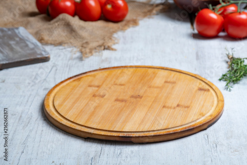 Rustic Vegetable Food Preparation Scene with Wooden Cutting Board