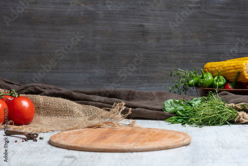 Rustic Vegetable Food Preparation Scene with Wooden Cutting Board