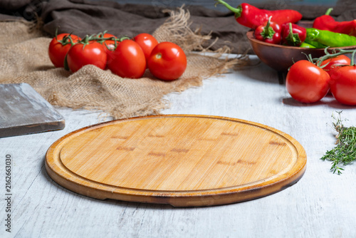 Rustic Vegetable Food Preparation Scene with Wooden Cutting Board