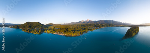 Lake Faaker See in Carinthia. Scenic aerial panorama of the famous lake and Mittagskogel mountain in Austria.