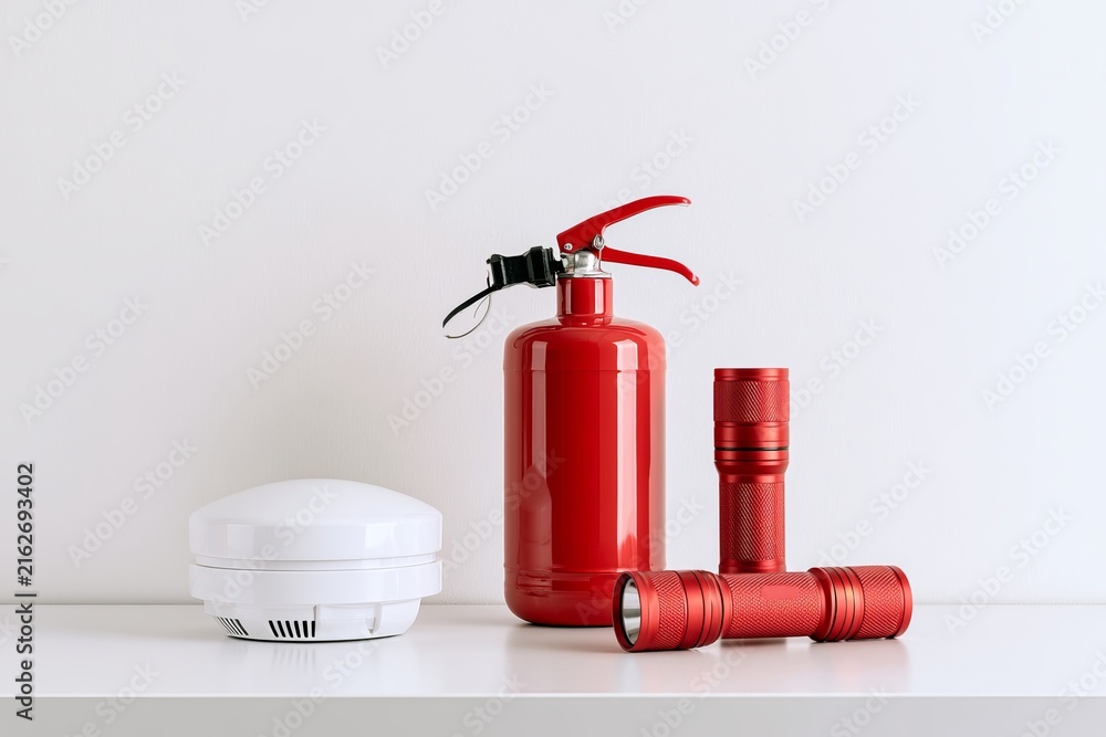 Obraz premium Fire safety equipment on a shelf in a well-lit indoor space during daytime