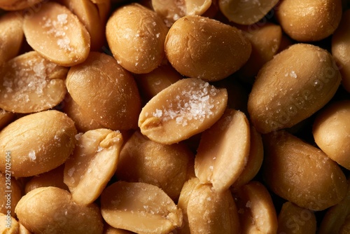 Salted peanuts in a bowl ready for a snack at a casual gathering or party in a home setting during the evening