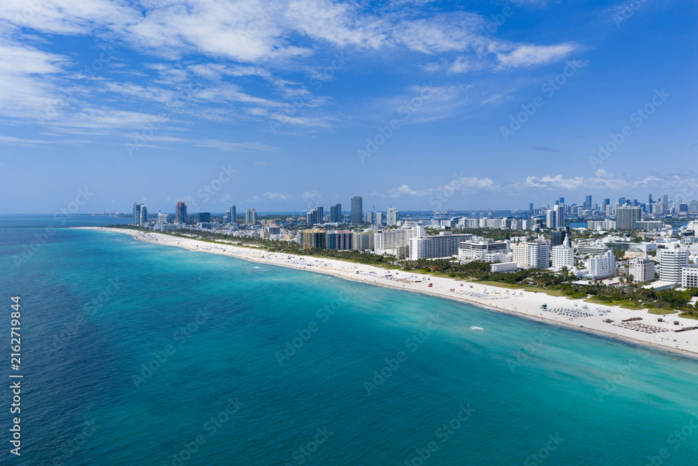Naklejka premium Miami beach with turquoise waters. Aerial view of sandy coastline and waves.