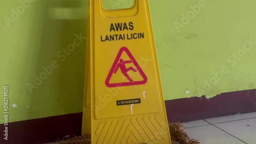 Warning Wet Floor Sign on Slippery Surface Safety Caution